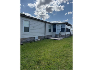 This stunning 2-bedroom, 2-bathroom home, including golf cart on Golden Lakes Golf Course in Florida - for sale on GolfHomes.com, golf home, golf lot