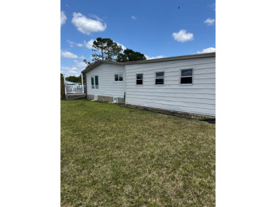 This stunning 2-bedroom, 2-bathroom home, including golf cart on Golden Lakes Golf Course in Florida - for sale on GolfHomes.com, golf home, golf lot