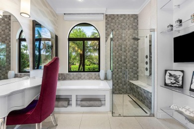 Perched on a rare, oversized lot at the end of a quiet on Boca Delray Golf and Country Club in Florida - for sale on GolfHomes.com, golf home, golf lot