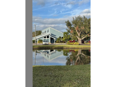 This stunning 2-bedroom, 2-bathroom home, including golf cart on Golden Lakes Golf Course in Florida - for sale on GolfHomes.com, golf home, golf lot