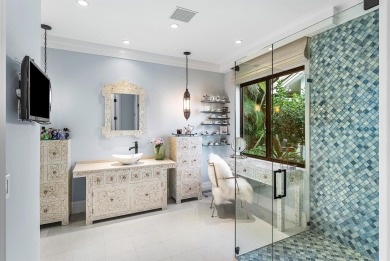 Perched on a rare, oversized lot at the end of a quiet on Boca Delray Golf and Country Club in Florida - for sale on GolfHomes.com, golf home, golf lot