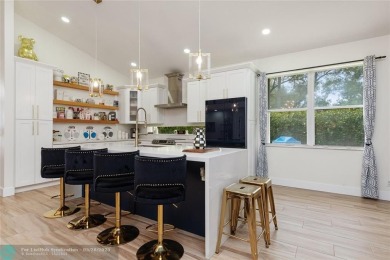 Beautifully updated home on an oversized 14,000 sq. ft. corner on TPC Eagle Trace in Florida - for sale on GolfHomes.com, golf home, golf lot