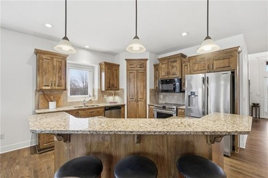 This beautifully updated reverse 1.5-story is just steps from on Prairie Highlands Golf Course in Kansas - for sale on GolfHomes.com, golf home, golf lot