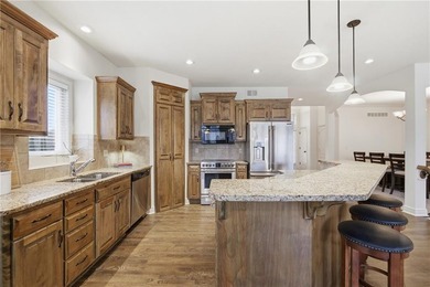 This beautifully updated reverse 1.5-story is just steps from on Prairie Highlands Golf Course in Kansas - for sale on GolfHomes.com, golf home, golf lot