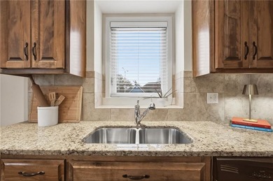 This beautifully updated reverse 1.5-story is just steps from on Prairie Highlands Golf Course in Kansas - for sale on GolfHomes.com, golf home, golf lot