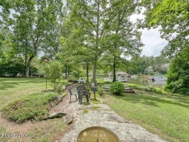 Lakefront Home with Detached Garage and Covered Boat Dock.  Step on Lake Tansi Village Country Club in Tennessee - for sale on GolfHomes.com, golf home, golf lot