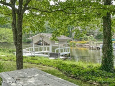 Lakefront Home with Detached Garage and Covered Boat Dock.  Step on Lake Tansi Village Country Club in Tennessee - for sale on GolfHomes.com, golf home, golf lot