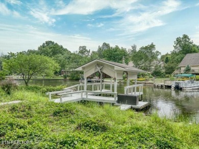 Lakefront Home with Detached Garage and Covered Boat Dock.  Step on Lake Tansi Village Country Club in Tennessee - for sale on GolfHomes.com, golf home, golf lot