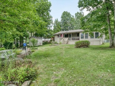 Lakefront Home with Detached Garage and Covered Boat Dock.  Step on Lake Tansi Village Country Club in Tennessee - for sale on GolfHomes.com, golf home, golf lot