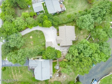 Lakefront Home with Detached Garage and Covered Boat Dock.  Step on Lake Tansi Village Country Club in Tennessee - for sale on GolfHomes.com, golf home, golf lot