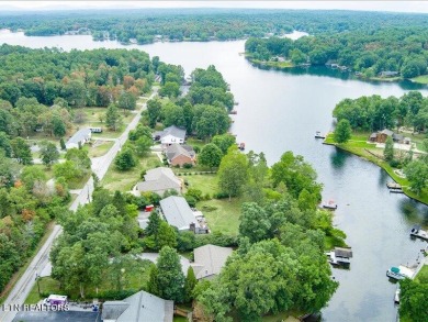 Lakefront Home with Detached Garage and Covered Boat Dock.  Step on Lake Tansi Village Country Club in Tennessee - for sale on GolfHomes.com, golf home, golf lot