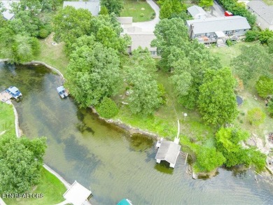 Lakefront Home with Detached Garage and Covered Boat Dock.  Step on Lake Tansi Village Country Club in Tennessee - for sale on GolfHomes.com, golf home, golf lot