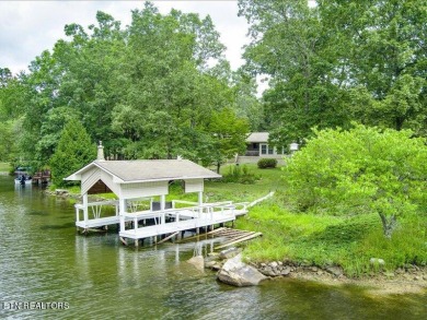 Lakefront Home with Detached Garage and Covered Boat Dock.  Step on Lake Tansi Village Country Club in Tennessee - for sale on GolfHomes.com, golf home, golf lot