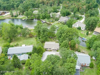 Lakefront Home with Detached Garage and Covered Boat Dock.  Step on Lake Tansi Village Country Club in Tennessee - for sale on GolfHomes.com, golf home, golf lot