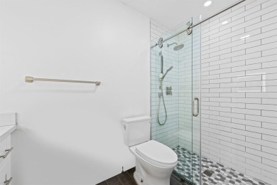 TOTALLY REMODELED 3/2 WITH 1 CAR GARAGE LOCATED RIGHT ACROSS THE on Eco Golf Club in Florida - for sale on GolfHomes.com, golf home, golf lot
