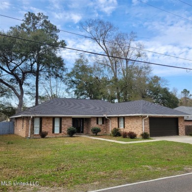 Modern single-family home for sale in Diamondhead, MS!-Luxury on Diamondhead Country Club in Mississippi - for sale on GolfHomes.com, golf home, golf lot