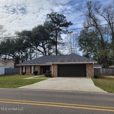 Modern single-family home for sale in Diamondhead, MS!-Luxury on Diamondhead Country Club in Mississippi - for sale on GolfHomes.com, golf home, golf lot