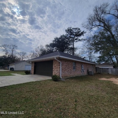 Modern single-family home for sale in Diamondhead, MS!-Luxury on Diamondhead Country Club in Mississippi - for sale on GolfHomes.com, golf home, golf lot