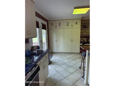 Welcome to this charming split-level home situated on the 18th on Wilson Country Club in North Carolina - for sale on GolfHomes.com, golf home, golf lot