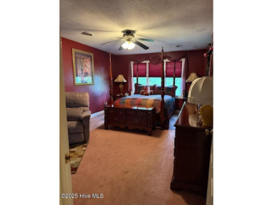 Welcome to a two story, roomy home with a lot of cozy living on Wilson Country Club in North Carolina - for sale on GolfHomes.com, golf home, golf lot