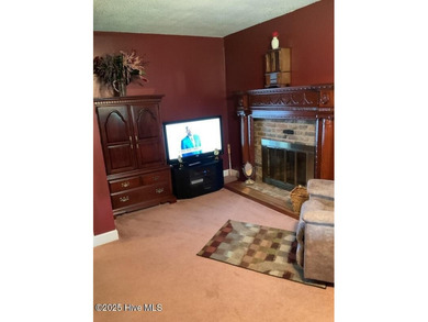 Welcome to this charming split-level home situated on the 18th on Wilson Country Club in North Carolina - for sale on GolfHomes.com, golf home, golf lot