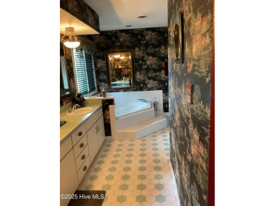 Welcome to a two story, roomy home with a lot of cozy living on Wilson Country Club in North Carolina - for sale on GolfHomes.com, golf home, golf lot