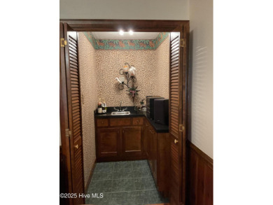 Welcome to a two story, roomy home with a lot of cozy living on Wilson Country Club in North Carolina - for sale on GolfHomes.com, golf home, golf lot