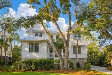 Completed in 2022, this custom creek and marsh front residence on Charleston National Golf Club in South Carolina - for sale on GolfHomes.com, golf home, golf lot