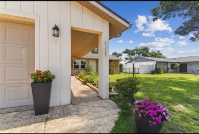 Lovely 3 bedroom 2 bathroom 2 car garage home with a split on Sherman Hills Golf Club in Florida - for sale on GolfHomes.com, golf home, golf lot