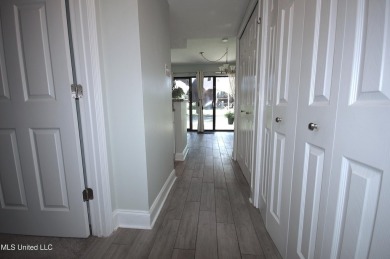 Welcome to your dream villa nestled in the vibrant heart of on Diamondhead Country Club in Mississippi - for sale on GolfHomes.com, golf home, golf lot