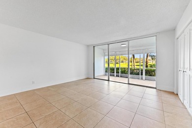 Beautiful & spacious 3/2 corner ground-floor unit (1,390 SF) on  in Florida - for sale on GolfHomes.com, golf home, golf lot