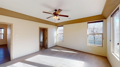 Lock-and-leave living - Colorado National Monument views - Near on Tiara Rado Golf Course in Colorado - for sale on GolfHomes.com, golf home, golf lot