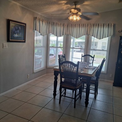 Located in a very active gated 55+ community with easy access to on Zephyrhills Municipal Golf Course in Florida - for sale on GolfHomes.com, golf home, golf lot