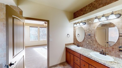 Lock-and-leave living - Colorado National Monument views - Near on Tiara Rado Golf Course in Colorado - for sale on GolfHomes.com, golf home, golf lot