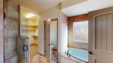 Lock-and-leave living - Colorado National Monument views - Near on Tiara Rado Golf Course in Colorado - for sale on GolfHomes.com, golf home, golf lot