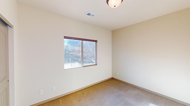 Lock-and-leave living - Colorado National Monument views - Near on Tiara Rado Golf Course in Colorado - for sale on GolfHomes.com, golf home, golf lot