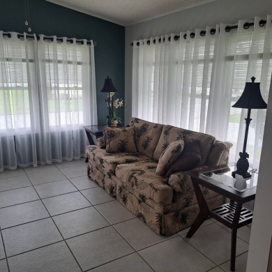 Located in a very active gated 55+ community with easy access to on Zephyrhills Municipal Golf Course in Florida - for sale on GolfHomes.com, golf home, golf lot