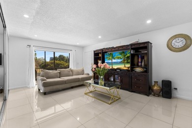 Bright 3/2 corner condo offering golf course living in Inverrary on Inverrary Country Club in Florida - for sale on GolfHomes.com, golf home, golf lot