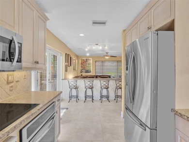 Largest 1 story , situated on a tree lined street in the Gated on The Club at Emerald Hills in Florida - for sale on GolfHomes.com, golf home, golf lot