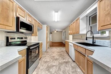 Discover a blend of nature and comfort in this 2 level home on Bella Vista Country Club - Berksdale in Arkansas - for sale on GolfHomes.com, golf home, golf lot