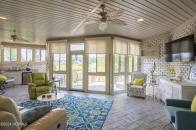 This home boasts captivating sunset views over the 3rd hole of on Cape Fear National At Brunswick Forest in North Carolina - for sale on GolfHomes.com, golf home, golf lot