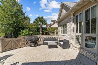 This home boasts captivating sunset views over the 3rd hole of on Cape Fear National At Brunswick Forest in North Carolina - for sale on GolfHomes.com, golf home, golf lot