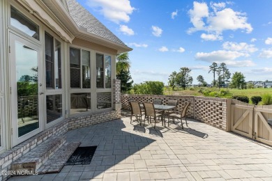 This home boasts captivating sunset views over the 3rd hole of on Cape Fear National At Brunswick Forest in North Carolina - for sale on GolfHomes.com, golf home, golf lot