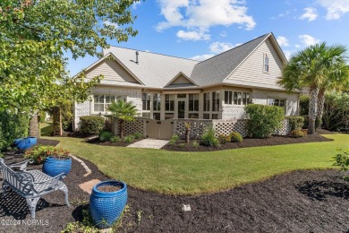 This home boasts captivating sunset views over the 3rd hole of on Cape Fear National At Brunswick Forest in North Carolina - for sale on GolfHomes.com, golf home, golf lot