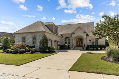 This home boasts captivating sunset views over the 3rd hole of on Cape Fear National At Brunswick Forest in North Carolina - for sale on GolfHomes.com, golf home, golf lot