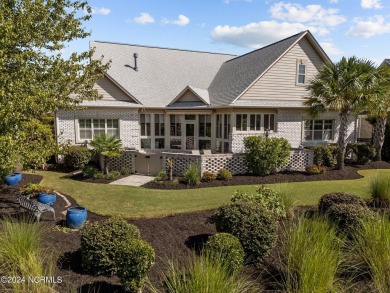 This home boasts captivating sunset views over the 3rd hole of on Cape Fear National At Brunswick Forest in North Carolina - for sale on GolfHomes.com, golf home, golf lot