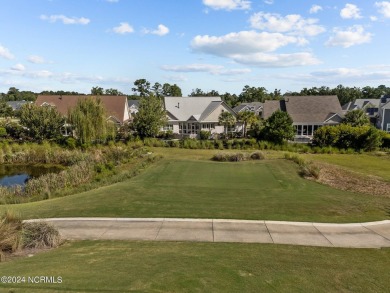 This home boasts captivating sunset views over the 3rd hole of on Cape Fear National At Brunswick Forest in North Carolina - for sale on GolfHomes.com, golf home, golf lot