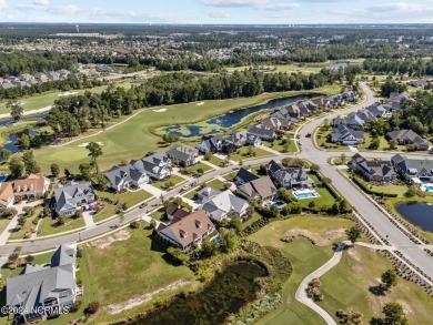 This home boasts captivating sunset views over the 3rd hole of on Cape Fear National At Brunswick Forest in North Carolina - for sale on GolfHomes.com, golf home, golf lot