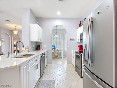 Expanded IBIS II pool home with serene lake and fountain views on Herons Glen Golf and Country Club in Florida - for sale on GolfHomes.com, golf home, golf lot