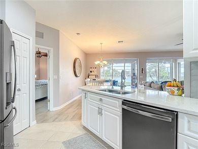 Expanded IBIS II pool home with serene lake and fountain views on Herons Glen Golf and Country Club in Florida - for sale on GolfHomes.com, golf home, golf lot